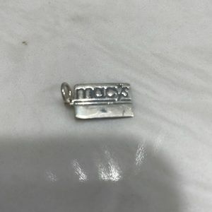 Macy’s charm- sterling silver